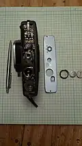internal mechanism exposed under bottom plate