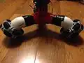 Because the pipes are at a 45° angle, the wheels are also at an angle and not parallel to the ground.